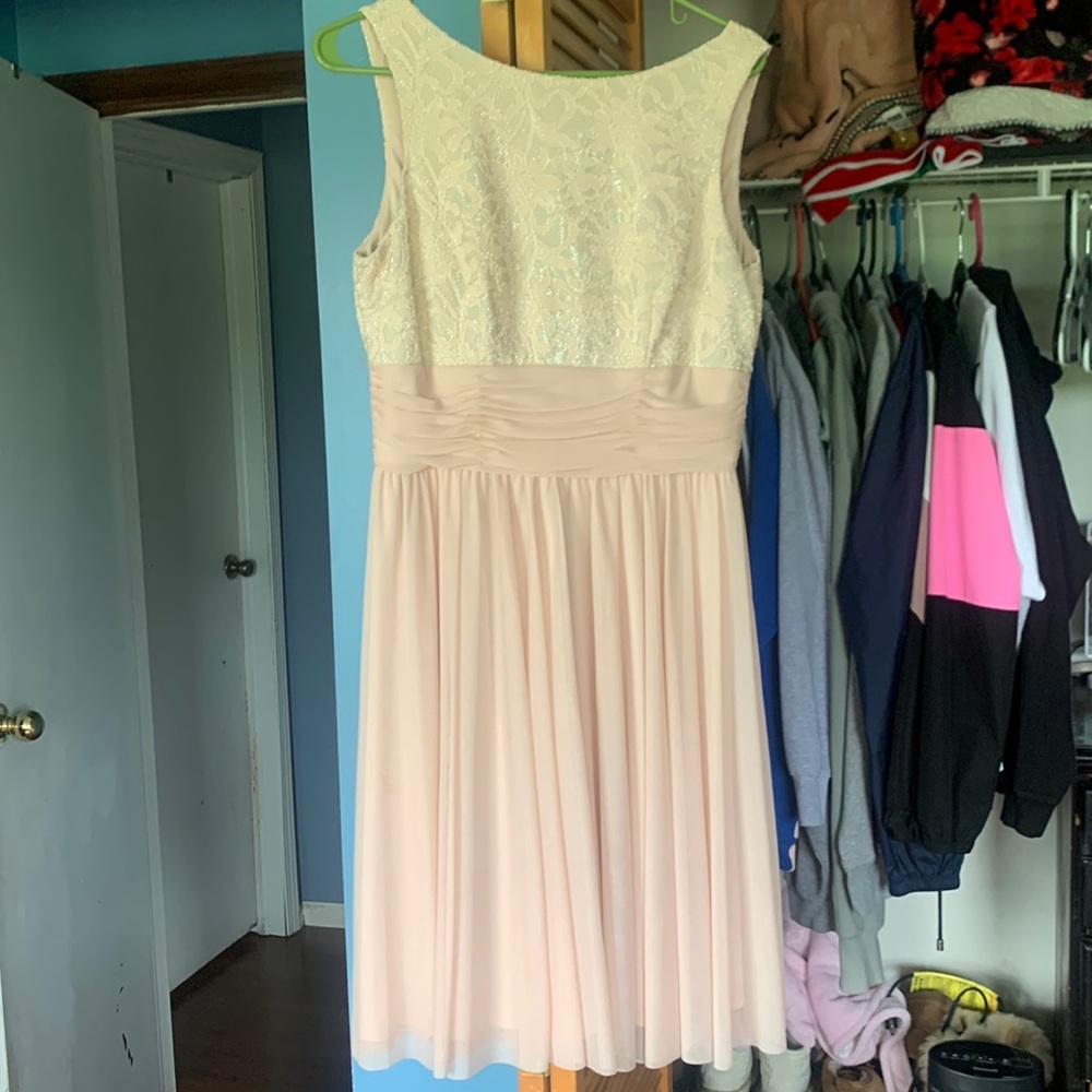 Prom dress, it’s a cream color the top is sparkly it is also knee high
